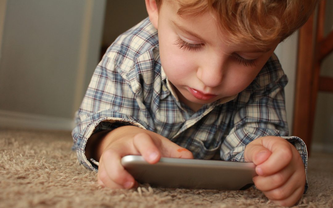 child playing on mobile