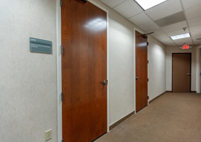 wooden doors along a hallway