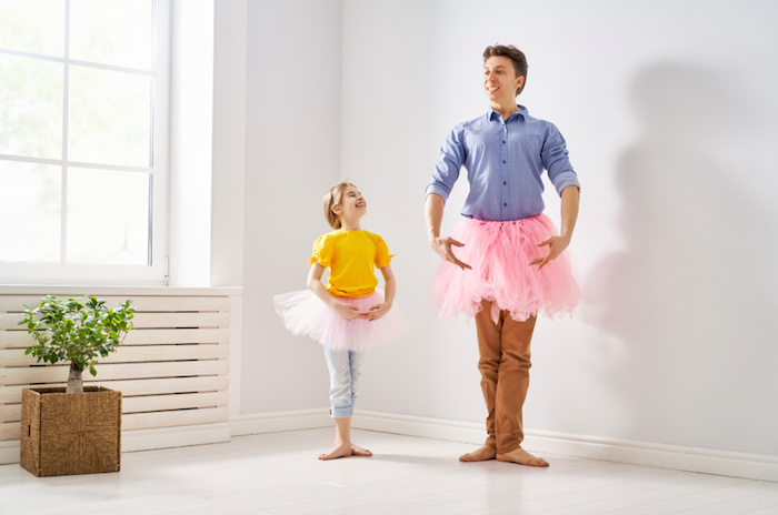 man and small girl wearing tutus for ballet 