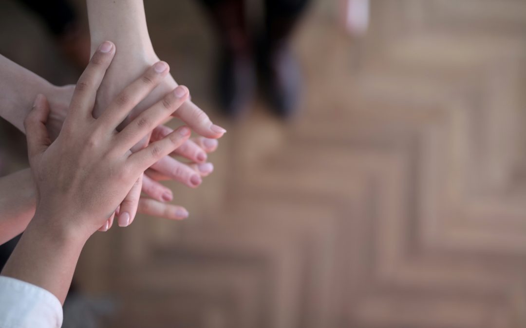 cropped image of group stacked hands
