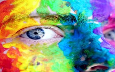 close up face with rainbow paint