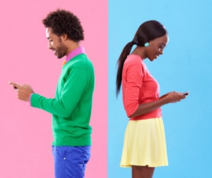 Man and woman on their cell phones wearing bright colors