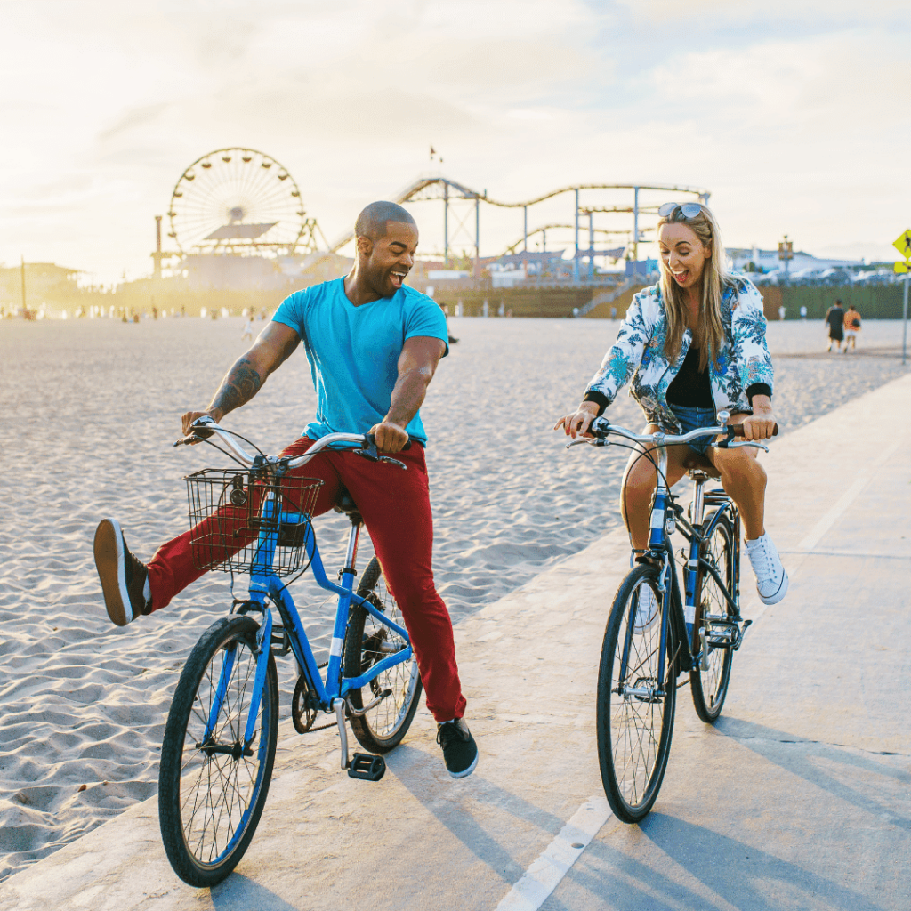 a person and person riding bicycles on a beach
