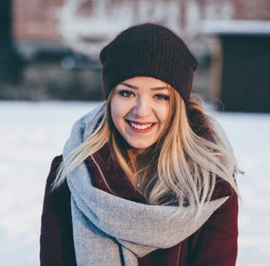 a woman in a hat and scarf